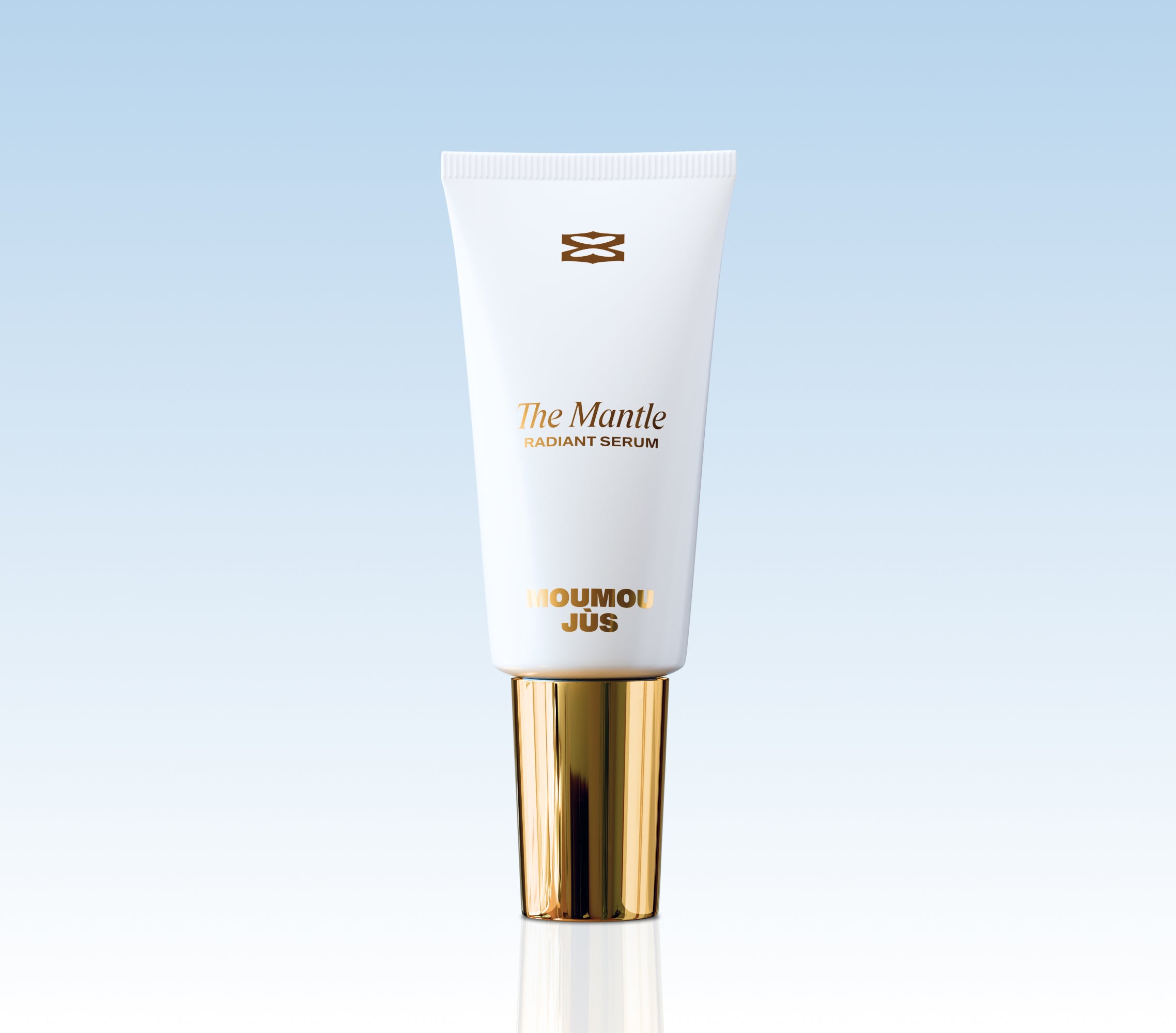 Skincare serum tube with gold cap on a light blue background